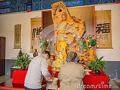 Tourist of people Praying to Goddess of Compassion or Guanyin goddess Statue in Tianmen Temple Editorial Stock Photo