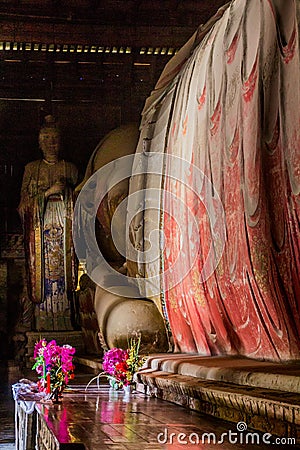 ZHANGYE, CHINA - AUGUST 23, 2018: Reclining Buddha in Giant Buddha Dafo Temple in Zhangye, Gansu Province, Chi Stock Photo