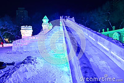 Harbin Ice Festival 2018 -Long Slide - fantastic ice and snow buildings, fun, sledging, night, travel china Editorial Stock Photo