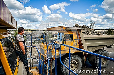 Zhodzina, Belarus - August 16, 2013: Granite mining in Quarry Trucks quarry of BelAZ producer Editorial Stock Photo