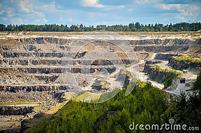 Zhodzina, Belarus - August 16, 2013: Granite mining in Quarry Trucks quarry of BelAZ producer Stock Photo