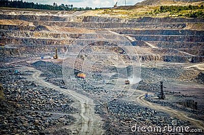 Zhodzina, Belarus - August 16, 2013: Granite mining in Quarry Trucks quarry of BelAZ producer Stock Photo