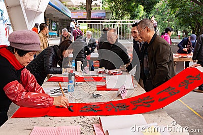 People writing Chinese new year scrolls Editorial Stock Photo