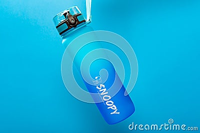 Giant size blue plastic water bottle for boy Editorial Stock Photo