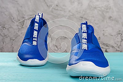 Pair of blue sporty shoes for kid Editorial Stock Photo
