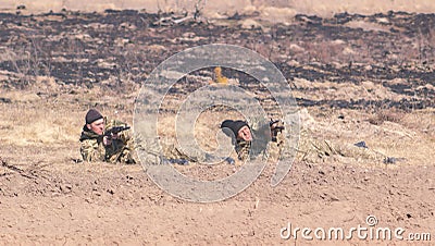 Zhytomyr, Ukraine - March 5, 2015: Front Line. Military attack on battlefield from ambush Editorial Stock Photo