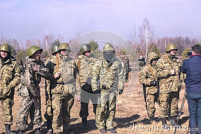 Zhytomyr, Ukraine - March 5, 2015: Front Line. Military attack on battlefield from ambush Editorial Stock Photo