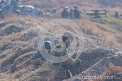 Zhytomyr, Ukraine - March 5, 2015: Front Line. Military attack on battlefield from ambush Editorial Stock Photo