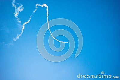 Zigzags of an airplane jet in the sky Stock Photo