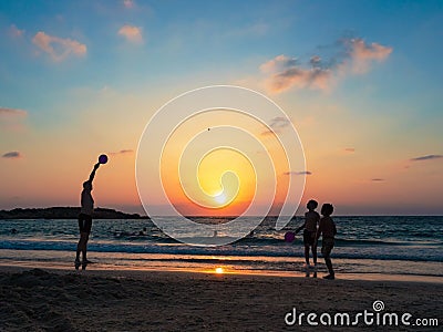 People actively spend time on the beach at sunset Editorial Stock Photo