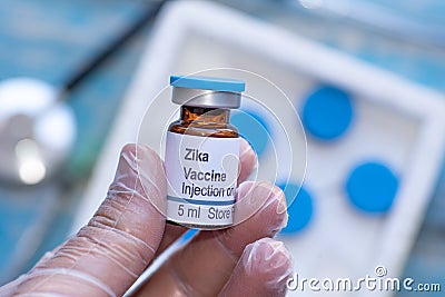 Zika virus vaccine vial in doctors hand Stock Photo