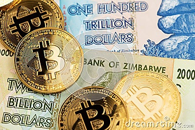 Zimbabwe hyperinflation banknotes and Bitcoin Cryptocurrency coins Stock Photo