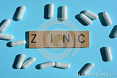 Zinc, word and white capsules Stock Photo