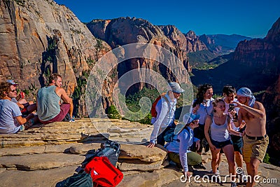 ZION, UTAH, USA - JUNE 14, 2018: Outdoor beautiful view of young hikers looking at view in Zion National park. People Editorial Stock Photo