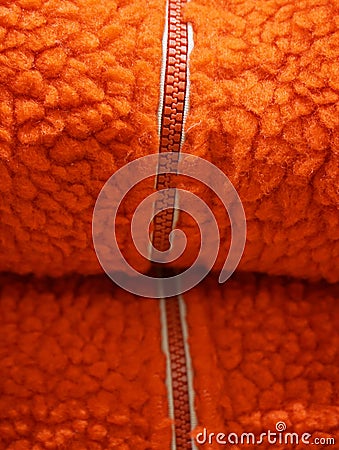 Zipper on orange wool texture background Stock Photo