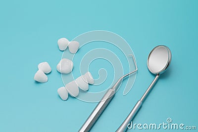 Dental tools and Zircon dentures on a blue background - Ceramic veneers - lumineers Stock Photo