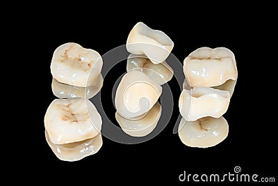 Zirconium tooth crown macro. Isolate on a black background. Aesthetic restoration of tooth loss Stock Photo