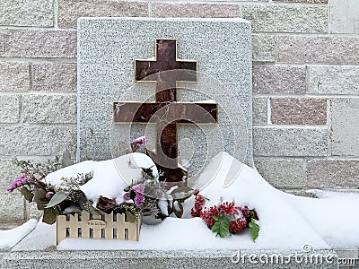 Zlatoust, Chelyabinsk region, Russia, January, 19, 2020. Memorial cross at the wall of the bell tower in Zlatoust on Red hill in w Stock Photo