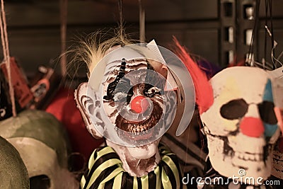 Zombie scary clown in a shop Halloween Costume Store Stock Photo