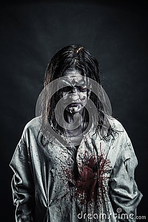 Zombie woman with bloody face Stock Photo