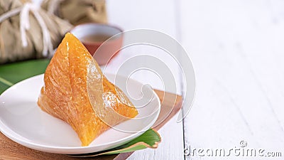 Zongzi - Alkaline rice dumpling - Traditional sweet Chinese crystal food on a plate to eat for Dragon Boat Duanwu Festival Stock Photo