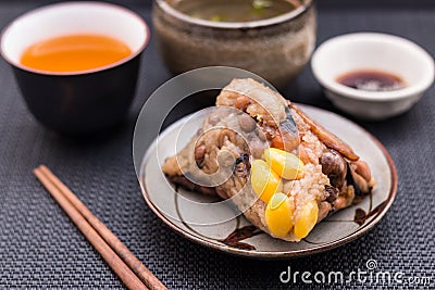 Zongzi or Asian Chinese sticky rice dumplings with Yellow tea, s Stock Photo