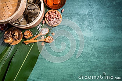 Zongzi, steamed rice dumplings on green table background, food in dragon boat festival duanwu concept, close up, copy space, top Stock Photo