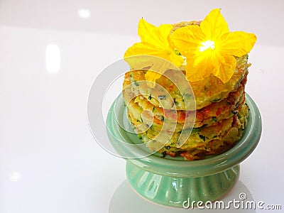 Zucchini cake decorated with cucumber flowers Stock Photo