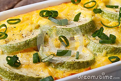 Zucchini casserole with cheese in a dish. horizontal macro Stock Photo