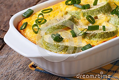 Zucchini casserole with cheese, eggs and green onion Stock Photo