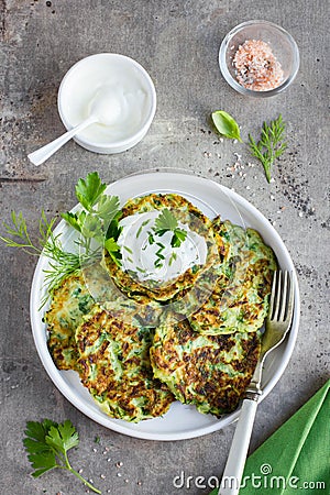 Zucchini fritters, vegetarian zucchini pancakes, served with fr Stock Photo