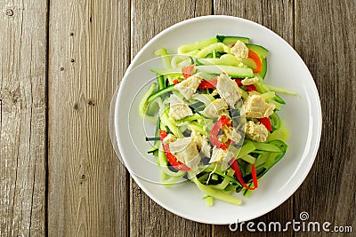 Zucchini noodle dish overhead view on wood Stock Photo