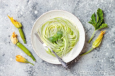 Zucchini spaghetti with basil. Vegetarian vegetable low carb pasta. Zucchini noodles or zoodles Stock Photo