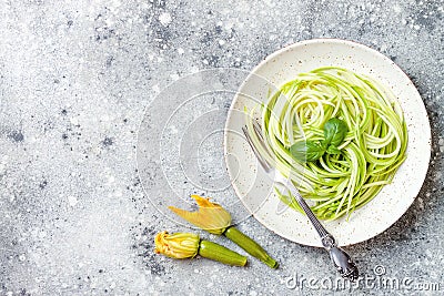 Zucchini spaghetti with basil. Vegetarian vegetable low carb pasta. Zucchini noodles or zoodles Stock Photo