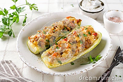 Zucchini stuffed with minced meat and tomatoes and cheese Stock Photo