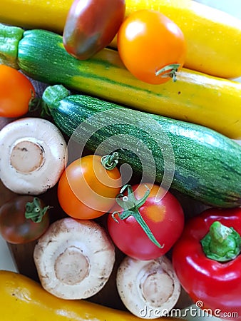 Zucchini, tomatoes, peppers, champignons. Juicy colors. Autumn still life. Red, yellow, white, green. Vegetable still life close-u Stock Photo