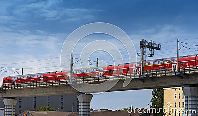 Deutsche Bahn train crosses a railway bridge in Berlin Editorial Stock Photo