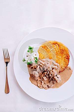 Zurich style veal stew and rosti potato, Swiss cuisine Stock Photo