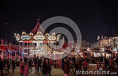 ZURICH, SWITZERLAND - December 19, 2019: People enjoying lively atmosphere of Zurich`s Christmas market with beautiful Editorial Stock Photo