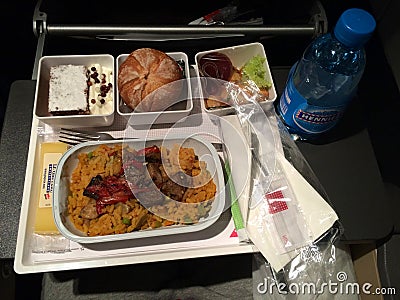 ZURICH, SWITZERLAND - MAR 31st, 2015: In flight hot meal of SWISS international airline in economy class, dinner meal Editorial Stock Photo