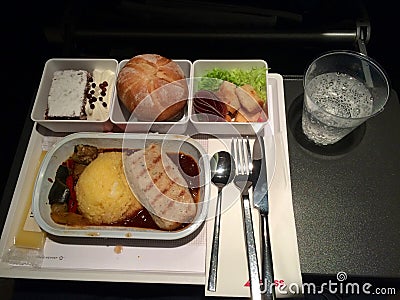 ZURICH, SWITZERLAND - MAR 31st, 2015: In flight hot meal of SWISS international airline in economy class, dinner meal Editorial Stock Photo