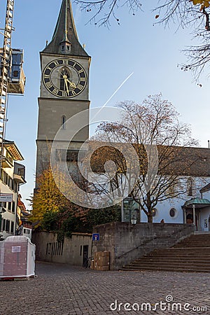 ZURICH, SWITZERLAND - 28 OCTOBER 2015 : St. Peter Church and autumn trees, City of Zurich Editorial Stock Photo