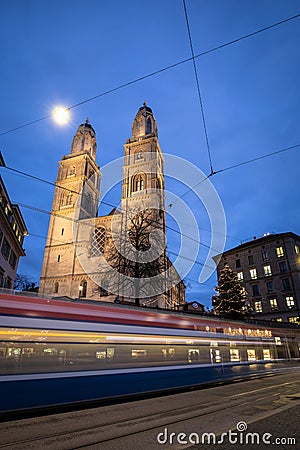 Zurich, Switzerland - view of the GrossmÃ¼nster church with motion blurred tramway Editorial Stock Photo