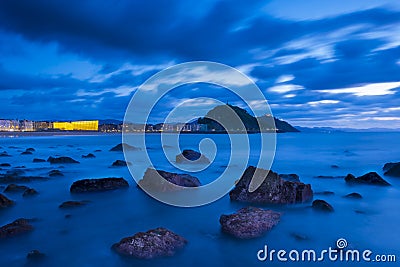 Zurriola beach sunset, Donostia city coast, San Sebastian, Euskadi Stock Photo