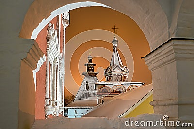 Tent-Roofed Towers Framed by Arch in the Winter Night Stock Photo