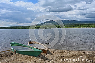 Zyuratkul lake scenic landscape with two boats Stock Photo