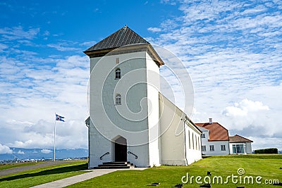 Landscape view of the church of the Bessastadir, a modest group of white, red-roofed buildings Editorial Stock Photo