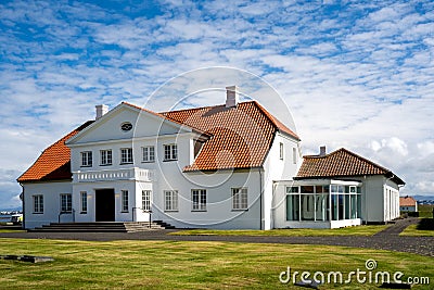 View of the main building of the Bessastadir, a modest group of white, red-roofed buildings that Editorial Stock Photo