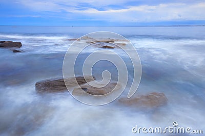 â€¨Rocks and waves at Kings Beach, QLD. Stock Photo