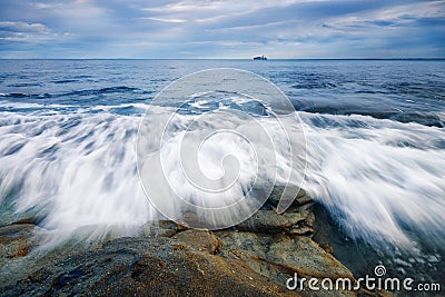 â€¨Rocks and waves at Kings Beach, QLD. Stock Photo